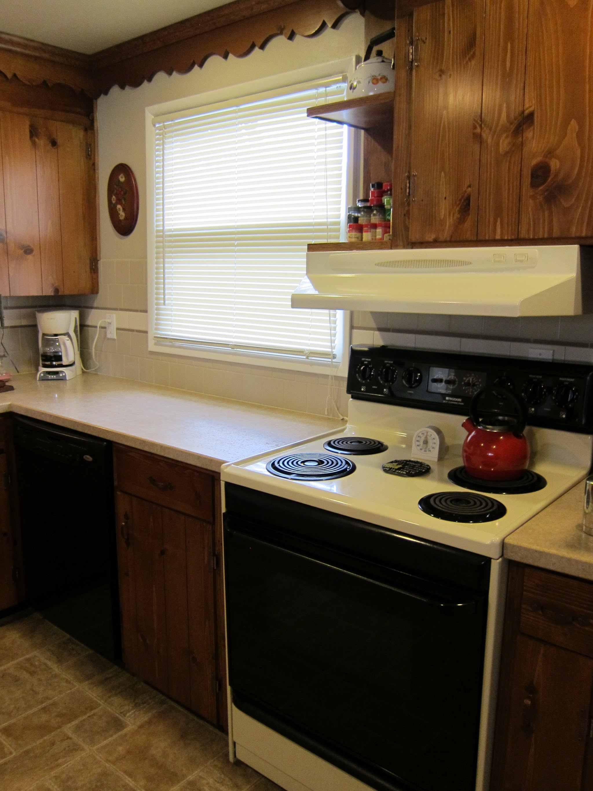 Farmhouse-style kitchen with knotty pine cabinetry